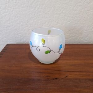 Festive White Candle Holder with Colorful Lights Design